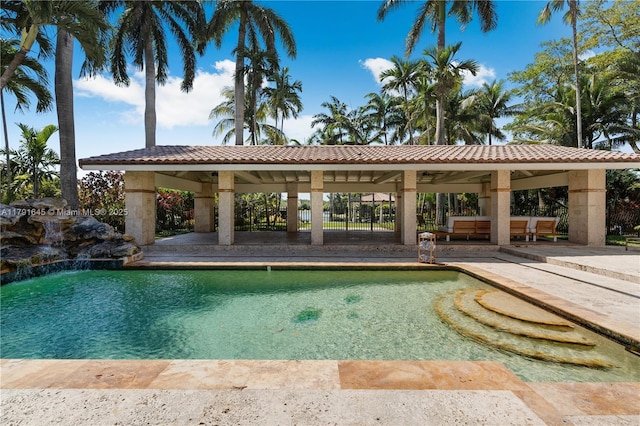 pool with a gazebo and a patio