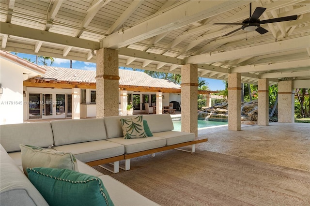 view of patio / terrace with an outdoor pool, a ceiling fan, french doors, and an outdoor living space