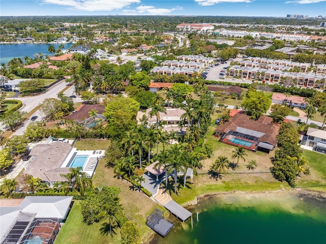 birds eye view of property with a residential view and a water view