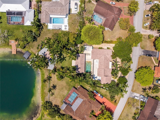 bird's eye view featuring a water view and a residential view