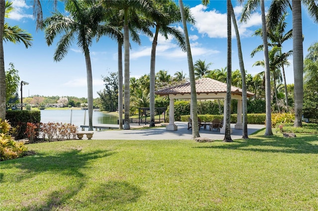 view of home's community featuring a gazebo, a water view, and a yard