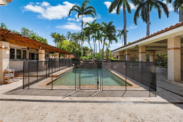 view of pool featuring fence, a fenced in pool, and a patio area