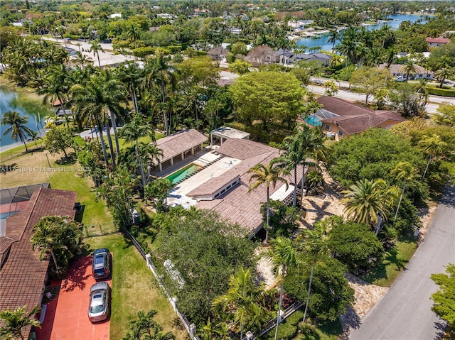 birds eye view of property with a residential view and a water view