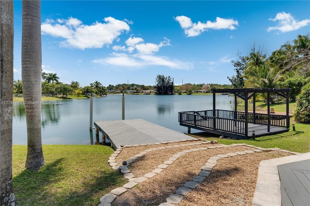 view of dock featuring a yard and a water view