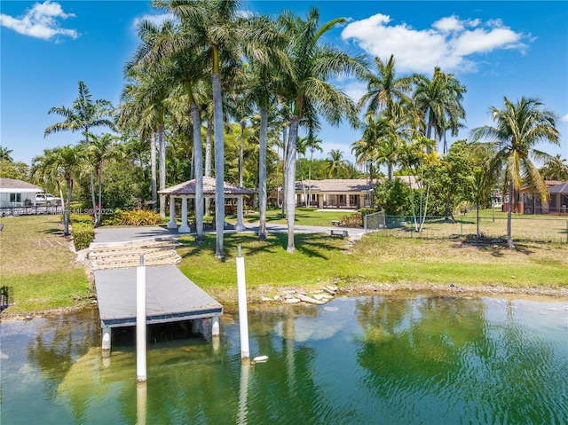 dock area featuring a gazebo, a yard, and a water view