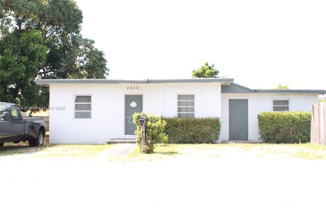 single story home with stucco siding