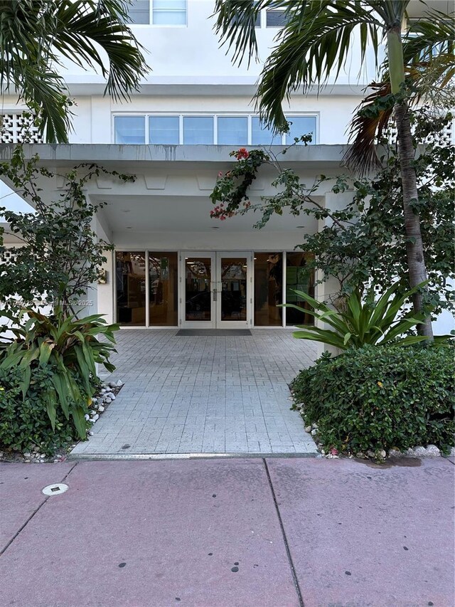 1750 James Ave Unit 10A, Miami Beach, FL 33139 - property entrance featuring french doors and stucco siding