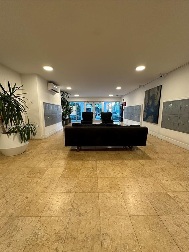 1750 James Ave Unit 10A, Miami Beach, FL 33139 - living room with an AC wall unit, recessed lighting, and baseboards
