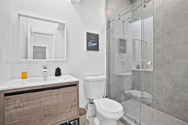 full bath with toilet, a shower stall, and vanity