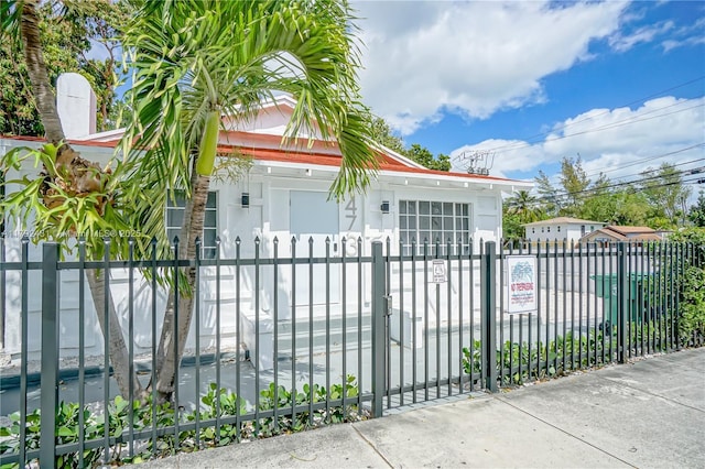 view of gate featuring a fenced front yard