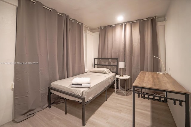 bedroom with light wood-type flooring