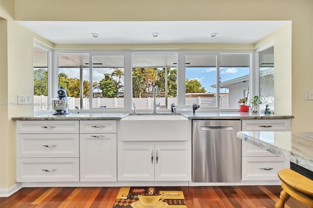 4701 Garfield St, Hollywood, FL 33021 - kitchen featuring light stone countertops, a sink, dark wood-type flooring, stainless steel dishwasher, and white cabinets