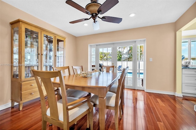 4701 Garfield St, Hollywood, FL 33021 - dining space featuring light wood finished floors, ceiling fan, french doors, and baseboards