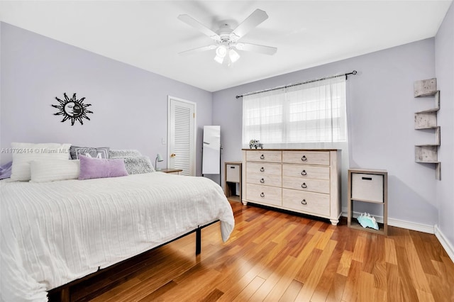 4701 Garfield St, Hollywood, FL 33021 - bedroom with a ceiling fan, light wood-style flooring, and baseboards