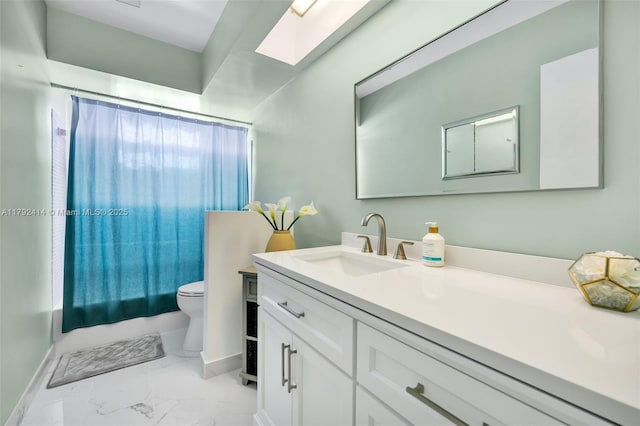 4701 Garfield St, Hollywood, FL 33021 - full bath with vanity, toilet, marble finish floor, baseboards, and a skylight