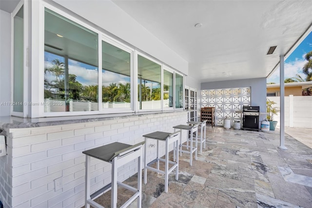 4701 Garfield St, Hollywood, FL 33021 - view of patio / terrace with outdoor dry bar, grilling area, and fence