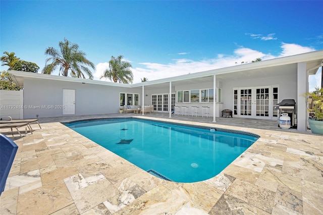 4701 Garfield St, Hollywood, FL 33021 - pool with french doors, area for grilling, and a patio area