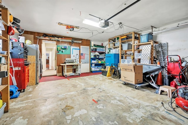 4701 Garfield St, Hollywood, FL 33021 - garage with a garage door opener, a workshop area, and freestanding refrigerator