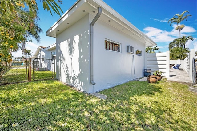 4701 Garfield St, Hollywood, FL 33021 - view of home's exterior with a patio, fence, stucco siding, and a yard
