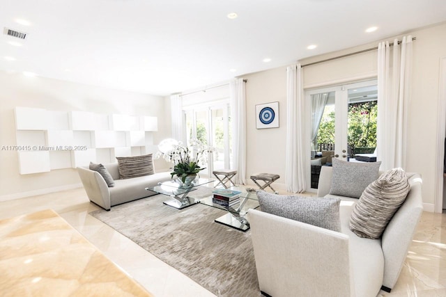 living room featuring visible vents, a healthy amount of sunlight, recessed lighting, and marble finish floor