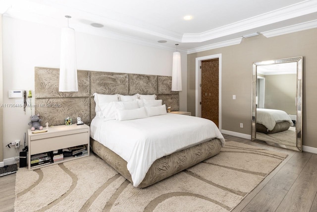 bedroom featuring ornamental molding, recessed lighting, wood finished floors, and baseboards
