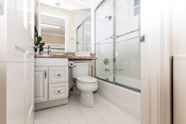 full bath featuring bath / shower combo with glass door, visible vents, toilet, vanity, and tile patterned flooring