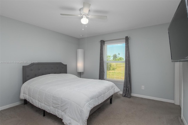 1808 NE 7th Ave, Cape Coral, FL 33909 - carpeted bedroom with a ceiling fan and baseboards