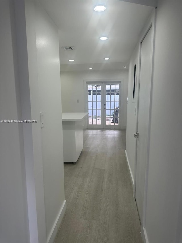 12025 SW 10th St Unit 204, Miami, FL 33184 - corridor with light wood-style floors, visible vents, baseboards, recessed lighting, and french doors