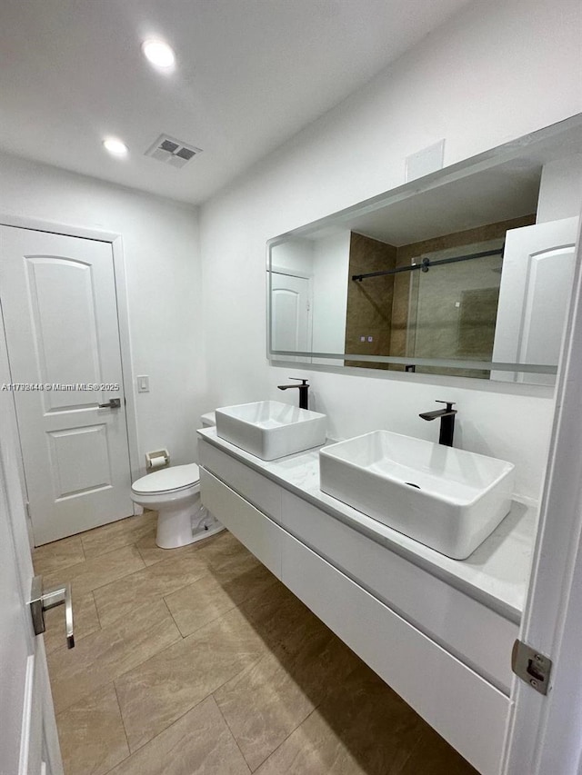 12025 SW 10th St Unit 204, Miami, FL 33184 - full bath featuring visible vents, toilet, a stall shower, and a sink