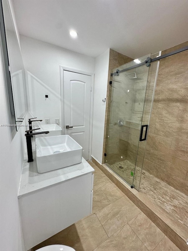 12025 SW 10th St Unit 204, Miami, FL 33184 - full bath with a stall shower, double vanity, a sink, and recessed lighting