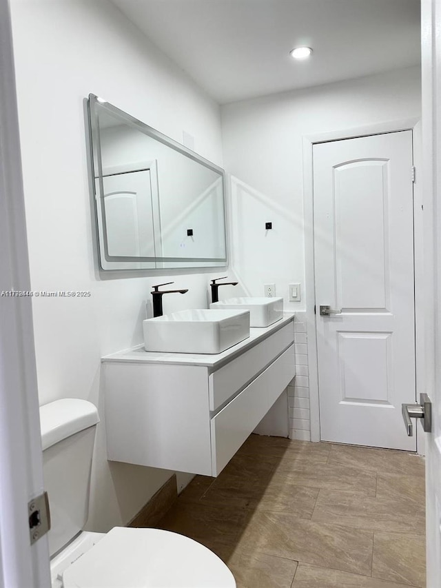 12025 SW 10th St Unit 204, Miami, FL 33184 - bathroom featuring toilet, recessed lighting, and vanity