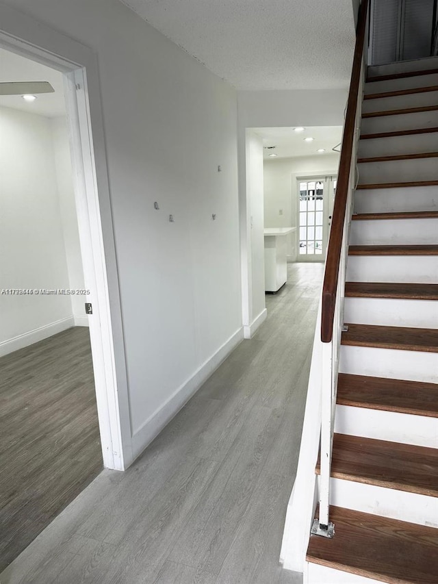 12025 SW 10th St Unit 204, Miami, FL 33184 - stairs featuring wood finished floors, recessed lighting, and baseboards