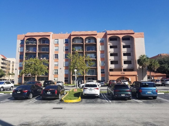 view of property with uncovered parking
