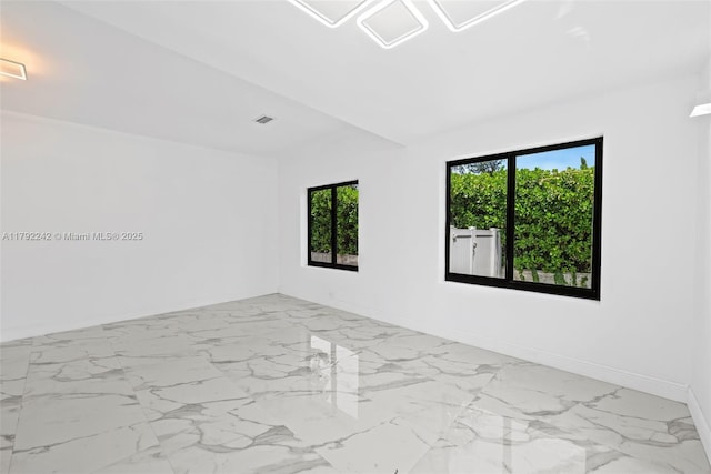 1683 NE 168th St, North Miami Beach, FL 33162 - empty room featuring marble finish floor, visible vents, and baseboards