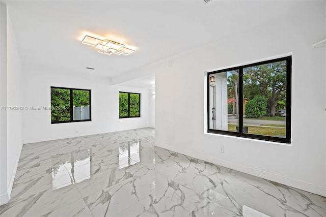 1683 NE 168th St, North Miami Beach, FL 33162 - spare room featuring marble finish floor and baseboards