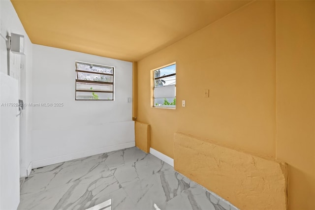 1683 NE 168th St, North Miami Beach, FL 33162 - empty room featuring marble finish floor and baseboards