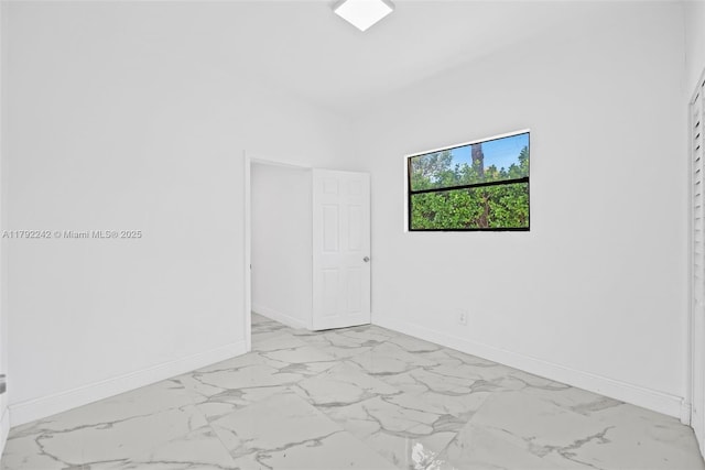 1683 NE 168th St, North Miami Beach, FL 33162 - spare room featuring baseboards and marble finish floor