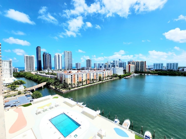 bird's eye view featuring a water view and a city view