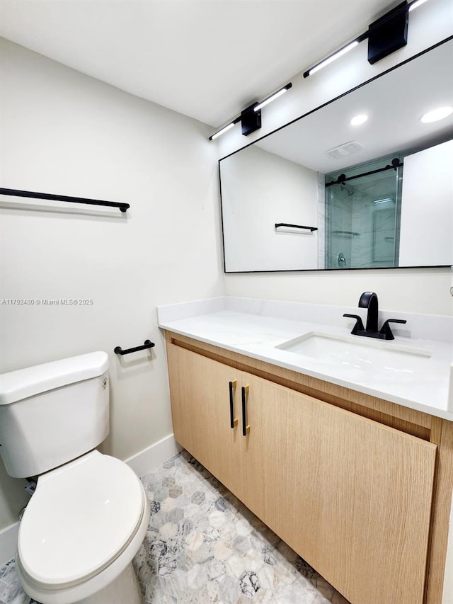 full bathroom with recessed lighting, vanity, toilet, a shower with shower door, and baseboards