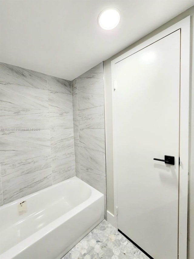 full bath with marble finish floor
