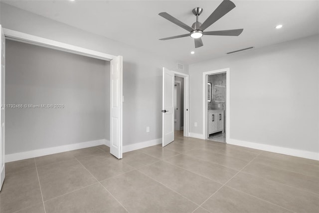 unfurnished bedroom featuring visible vents, baseboards, ensuite bathroom, recessed lighting, and tile patterned floors