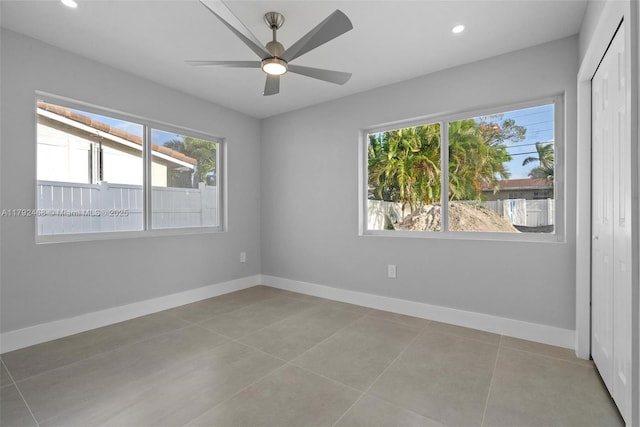 empty room with recessed lighting, baseboards, a ceiling fan, and light tile patterned floors