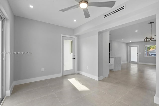 spare room featuring visible vents, a ceiling fan, baseboards, and recessed lighting