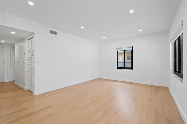 spare room featuring recessed lighting, baseboards, visible vents, and light wood finished floors