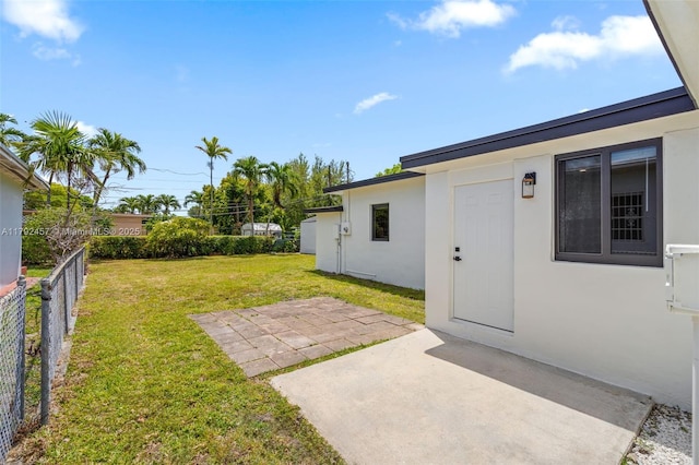 view of yard featuring fence and a patio area