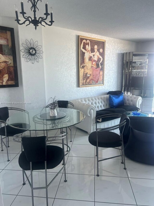 2841 NE 163rd St Unit 407, North Miami Beach, FL 33160 - dining area featuring a textured ceiling and a textured wall