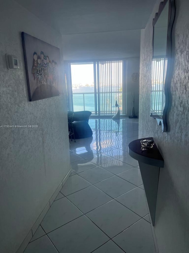 2841 NE 163rd St Unit 407, North Miami Beach, FL 33160 - corridor featuring tile patterned flooring