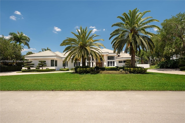 3425 Saddlebrook Ln, Weston, FL 33331 - view of front facade with concrete driveway, a front yard, and stucco siding