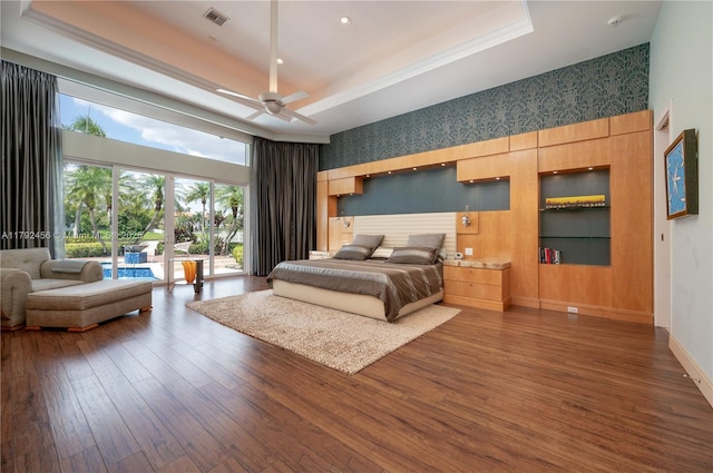 3425 Saddlebrook Ln, Weston, FL 33331 - bedroom with dark wood-style flooring, access to outside, a high ceiling, a raised ceiling, and visible vents