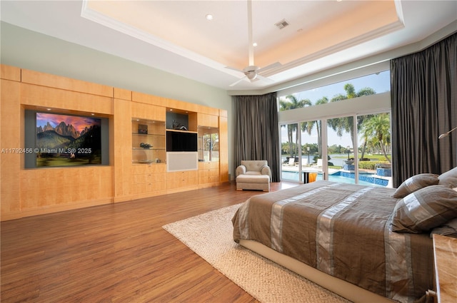 3425 Saddlebrook Ln, Weston, FL 33331 - bedroom with access to outside, visible vents, wood finished floors, and a raised ceiling